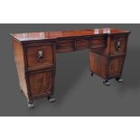 A Regency mahogany twin pedestal sideboard, the moulded top above three drawers and two cupboard