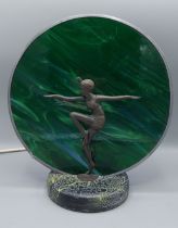 An Art Deco style table lamp mounted with a dancing lady and with a circular mottled glass shade