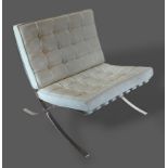 In the style of Ludwig Mies Van Der Rohe for Knoll a chrome and leather upholstered chair