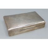 A London silver cigarette box of rectangular form, 14.5cms long