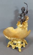 A French gilt metal bon-bon with patinated bronze model of Putti, 19cms tall
