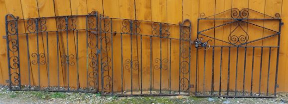 A pair of iron gates of scroll form, 105cms tall, both gates together 235cms wide together with