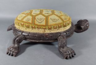 A Black Forest carved stool in the form of a tortoise, 43cms long