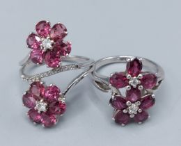 A 925 silver dress ring in the form of two flower heads set with amethyst together with another