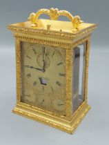A brass cased Carriage clock, the dial inscribed Viner and Co. London, with subsidiary day, date,