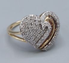 A 9ct yellow gold diamond set ring in the shape of a heart, ring size R, 4.2gms