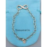 A 925 silver Infinity bracelet by Tiffany and Co. complete with Tiffany pouch