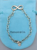 A 925 silver Infinity bracelet by Tiffany and Co. complete with Tiffany pouch