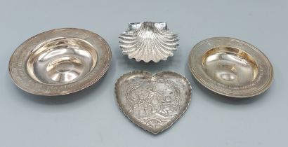 Two London silver commemorative bowls, a London silver dish of heart form and a 925 silver dish of