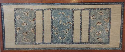 A Chinese silkwork panel decorated with butterflies amongst foliage, 44cms x 113cms