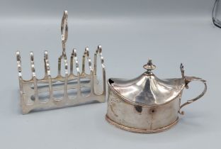 A Sheffield silver six division toast rack together with a George III oval mustard, London 1787,