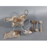 A Sheffield silver jug together with a London silver decanter label, three silver mustard spoons and