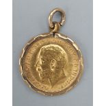 An Edwardian gold half Sovereign dated 1911 within 9ct gold pendant mount