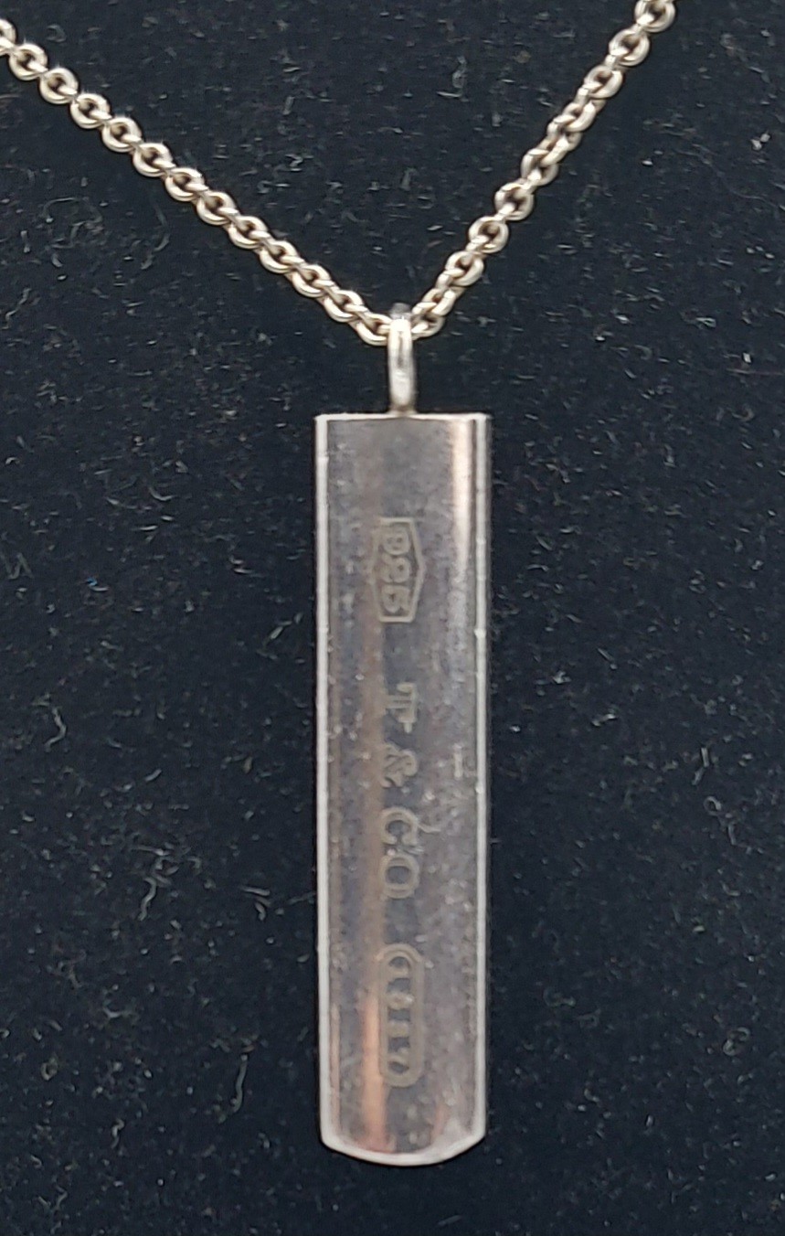 Tiffany and Co. a Sterling silver pendant of shaped ingot form with matching linked chain complete - Image 2 of 2