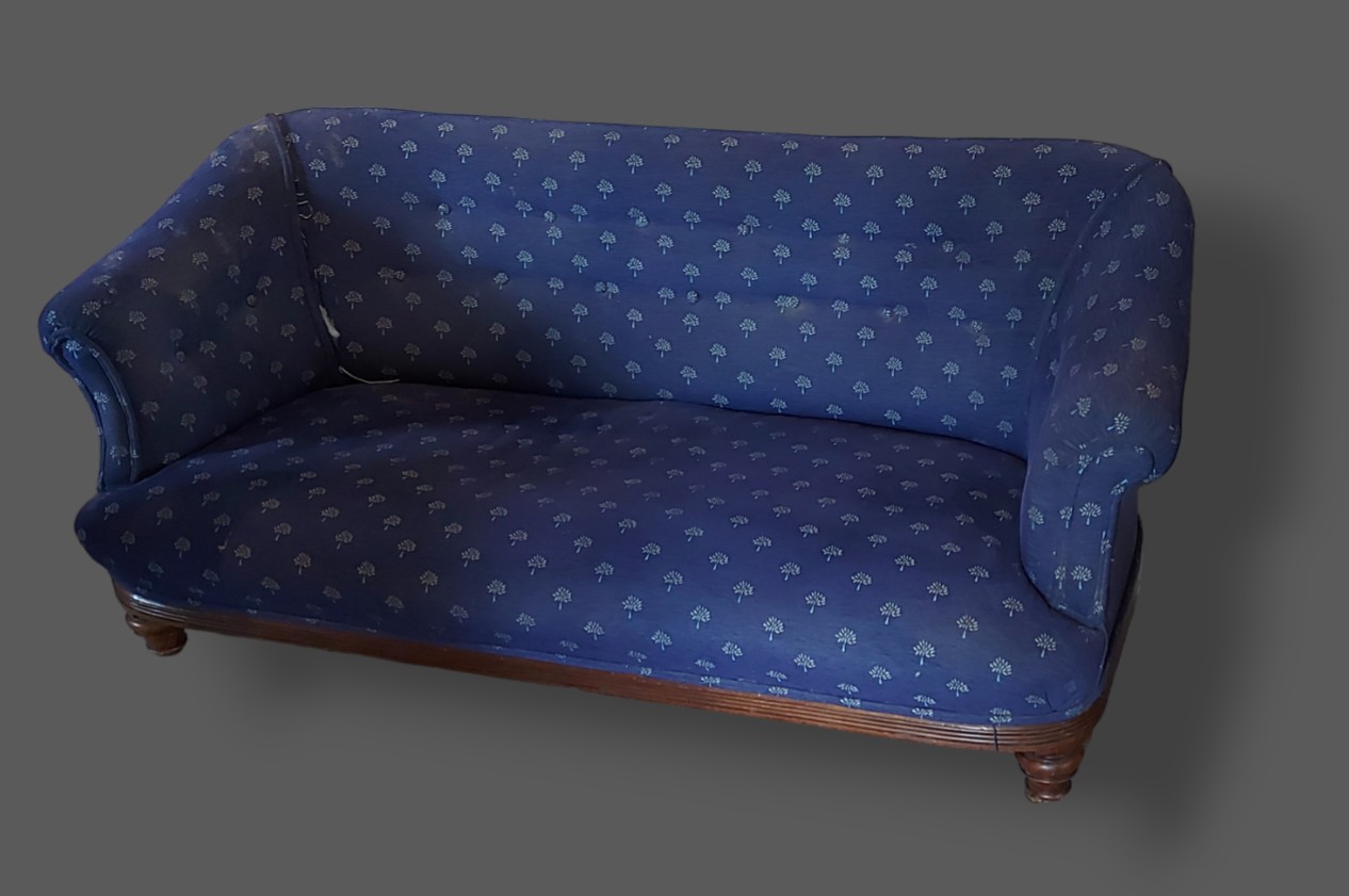 A Victorian small settee with blue upholstery raised upon low turned feet, 150cms long