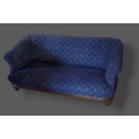 A Victorian small settee with blue upholstery raised upon low turned feet, 150cms long