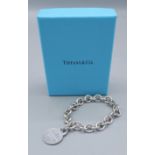 Tiffany and Co. a 925 silver linked bracelet with circular tab inscribed Please Return To Tiffany