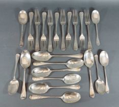 A George V silver canteen of rat tail flatware, comprising eight table spoons, ten table forks and