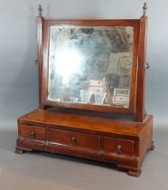 A 19th Century mahogany swing framed toilet mirror, the base with three drawers