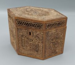 A George III rolled paper tea caddy of hexagonal form, 17.5cms wide, 9.5cms deep and 12cms tall
