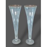 A pair of large glass spill vases of tapering form, 80cms tall
