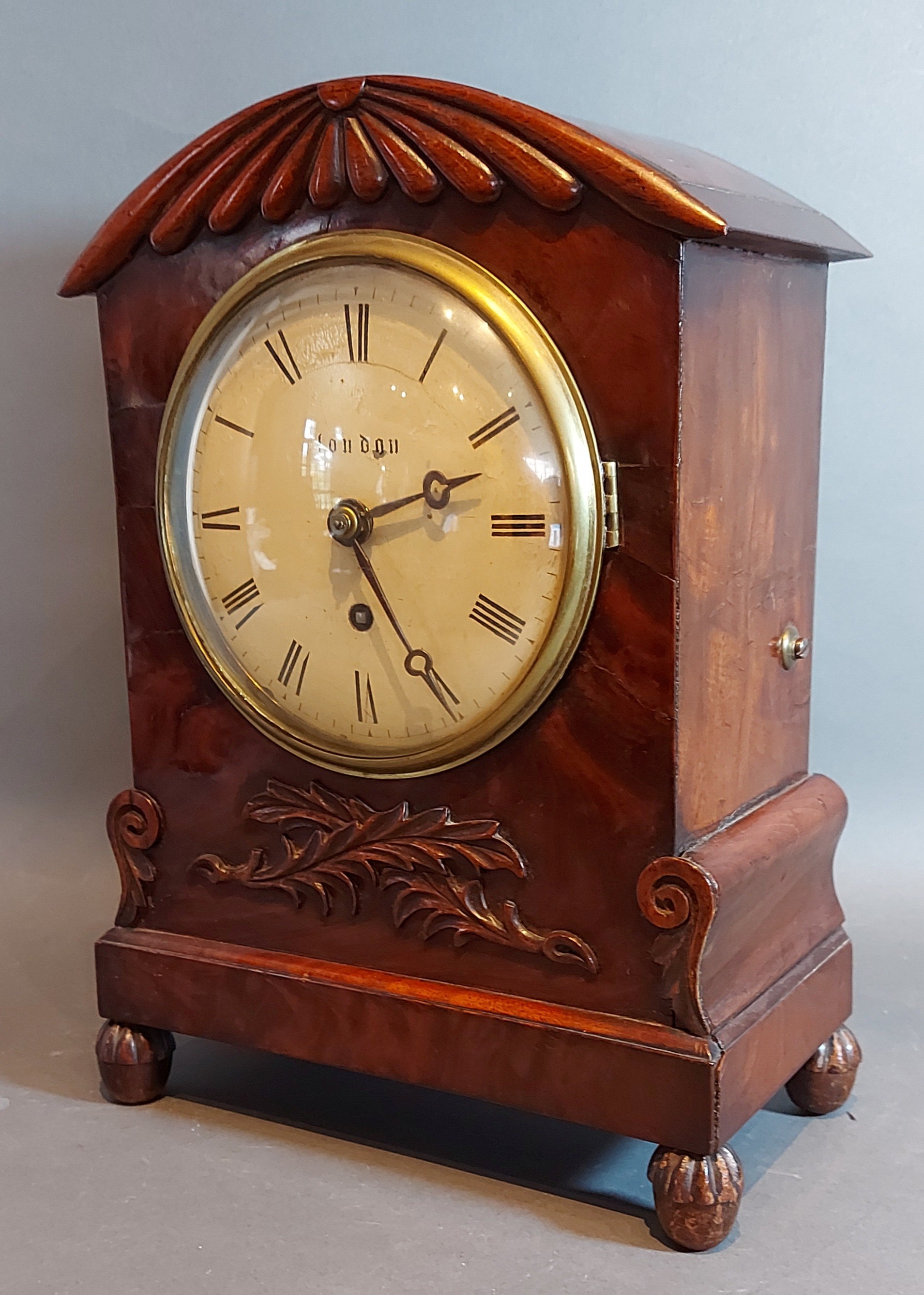 A William IV mahogany cased bracket clock with carved and shaped case,the circular enamel dial - Image 2 of 4