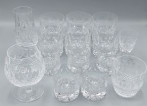 A set of six glass whiskey tumblers by Tudor together with five matching smaller glasses and four