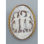 A 9ct gold framed oval cameo brooch depicting the three graces, 6cms by 5cms