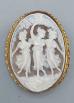 A 9ct gold framed oval cameo brooch depicting the three graces, 6cms by 5cms