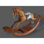 A Stevenson Brothers carved rocking horse, dated 1992, numbered 1132, 194cms long