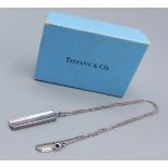 Tiffany and Co. a Sterling silver pendant of shaped ingot form with matching linked chain complete