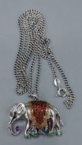 A 925 silver pendent in the form of an elephant set with multi coloured stones together with a