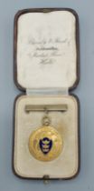 A 9ct gold and enamel decorated medallion, The Music Festival Society, 11.1gms