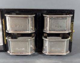 A set of four Birmingham silver napkin rings in fitted box