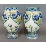 A pair of Moorcroft Macintyre vases decorated Poppy and Forget-Me-Nots, 11cms tall