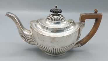 A Birmingham silver teapot of half lobed form, 8ozs
