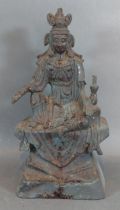 An early Chinese patinated metal model of a seated Deity, 22.5cms tall