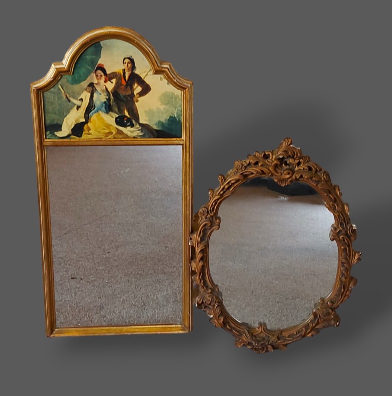A gilt framed wall mirror of dome form, together with a gilt framed oval wall mirror