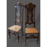 A pair of 19th Century oak Jacobean style side chairs, each with a carved cane back above a