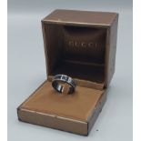 A Gucci Icon 18ct white gold and black synthetic Corundum band ring, ring size S, complete with ring