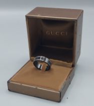 A Gucci Icon 18ct white gold and black synthetic Corundum band ring, ring size S, complete with ring