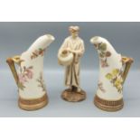A pair of Royal Worcester blush ivory tusk vases decorated in polychrome enamels and highlighted