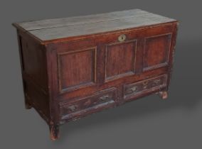 A George III pine Mule chest with a hinged top above a three panel front and two drawers flanked