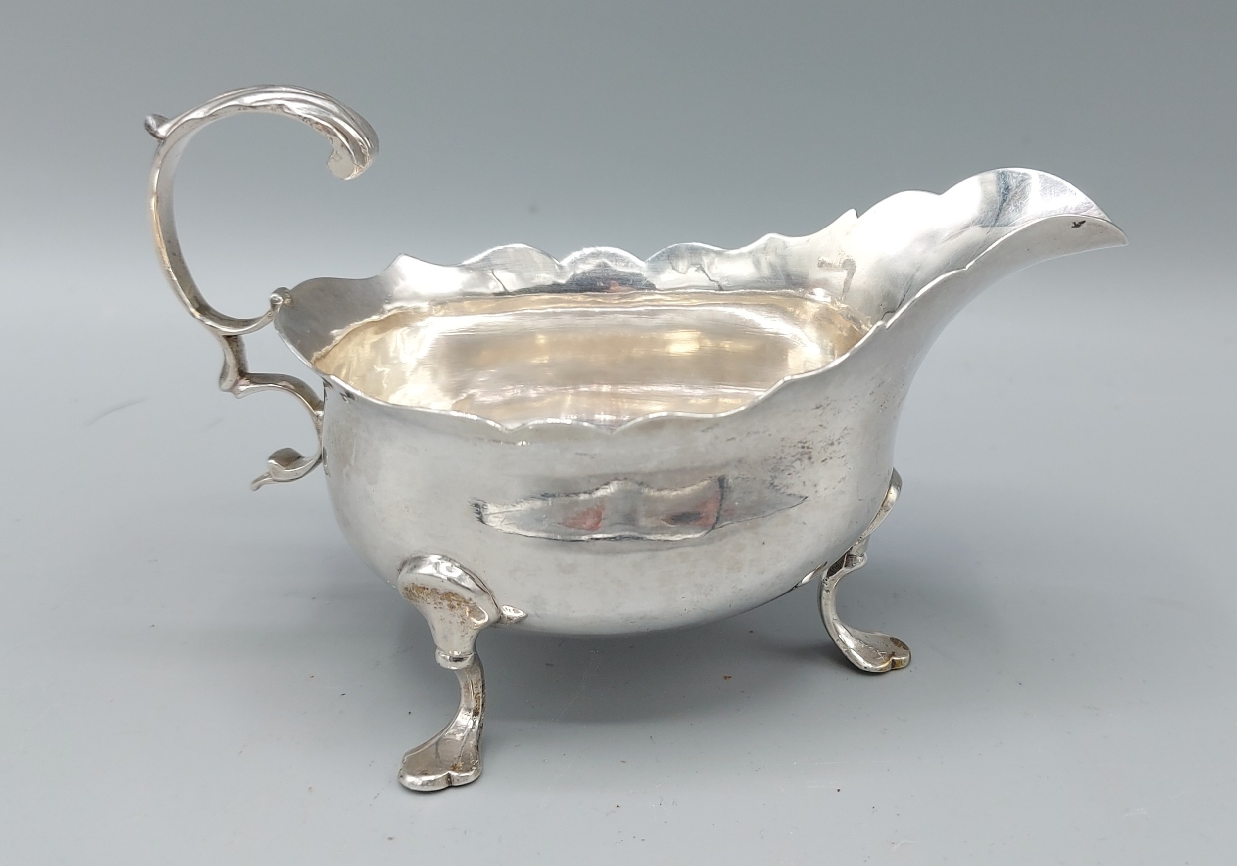 A George III silver sauce jug, London 1771, 3ozs