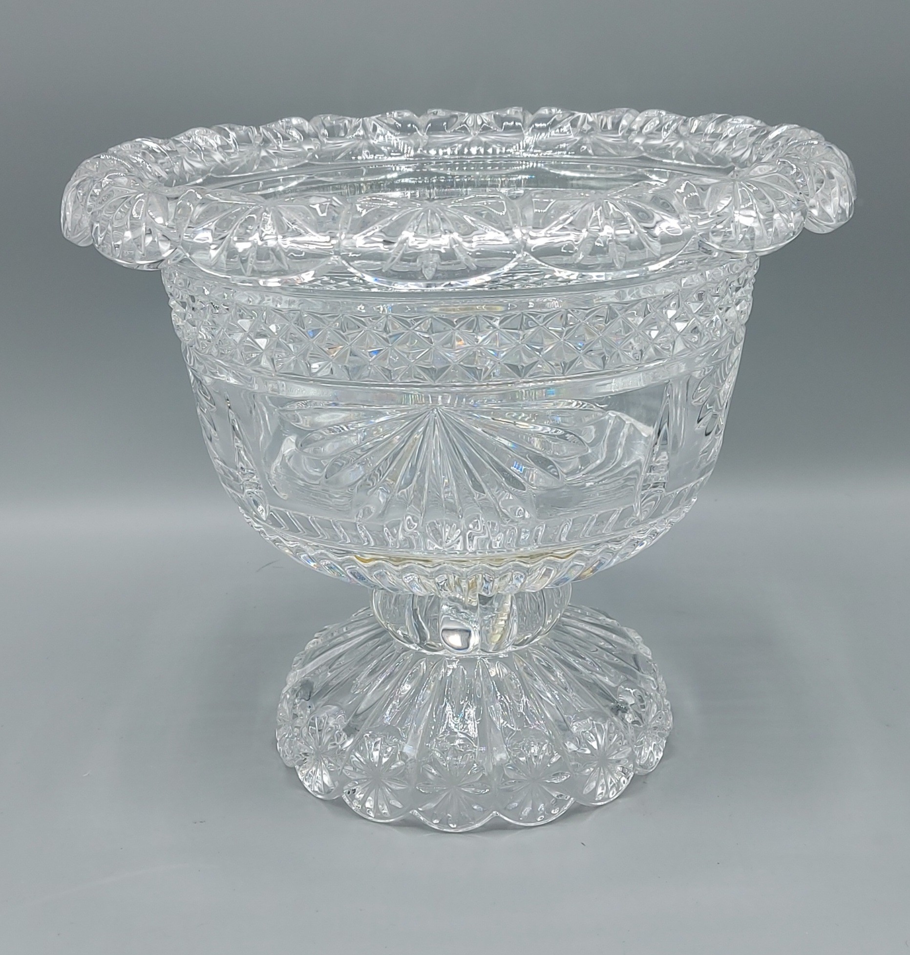 A large cut glass footed bowl, 21cms tall