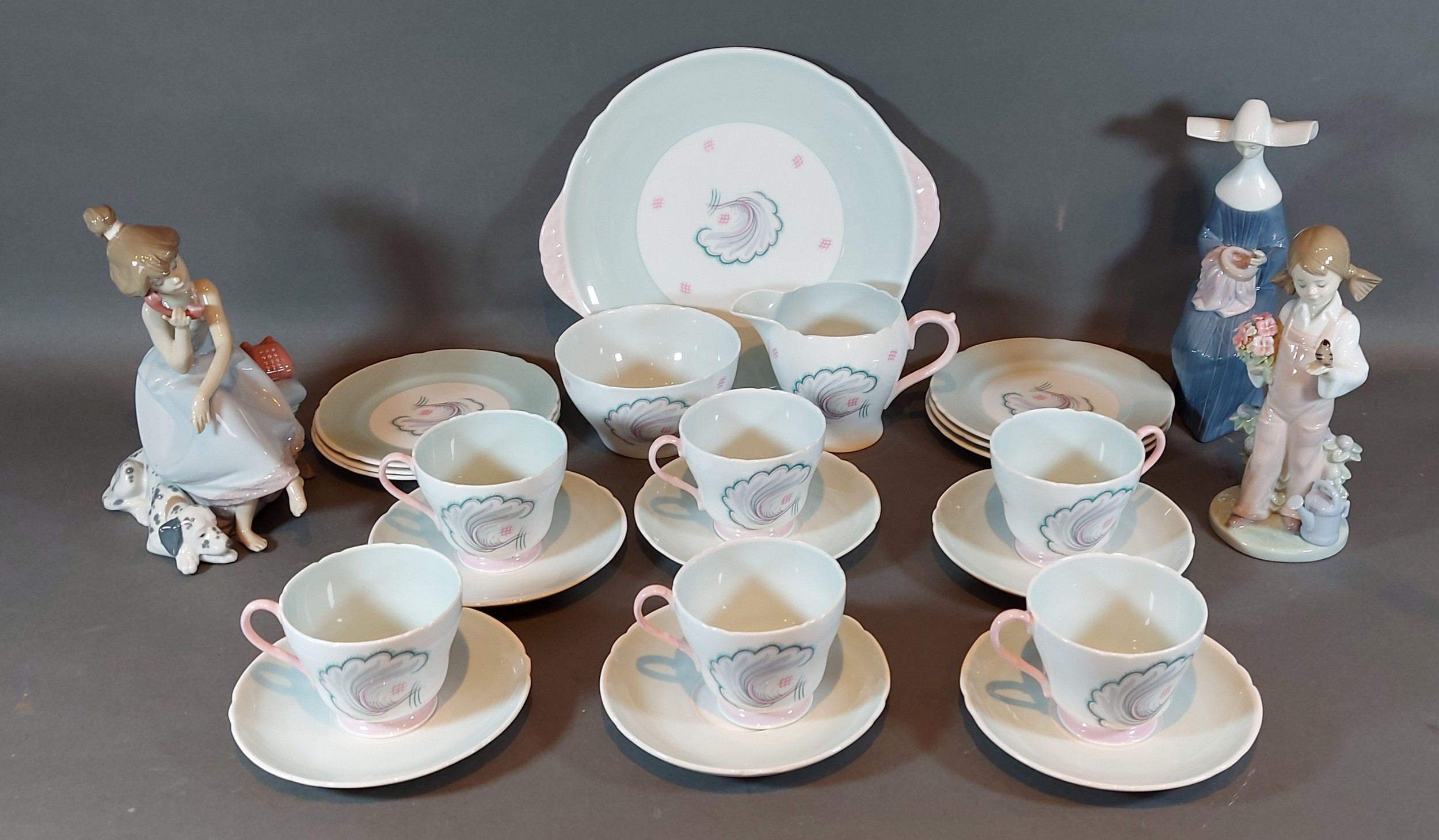 A Shelley Symphony pattern part tea service together with three Lladro figurines