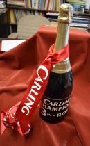 An unopened Magnum of Champagne with a red ribbon presented by the Sponsors Carling in May 2001 to