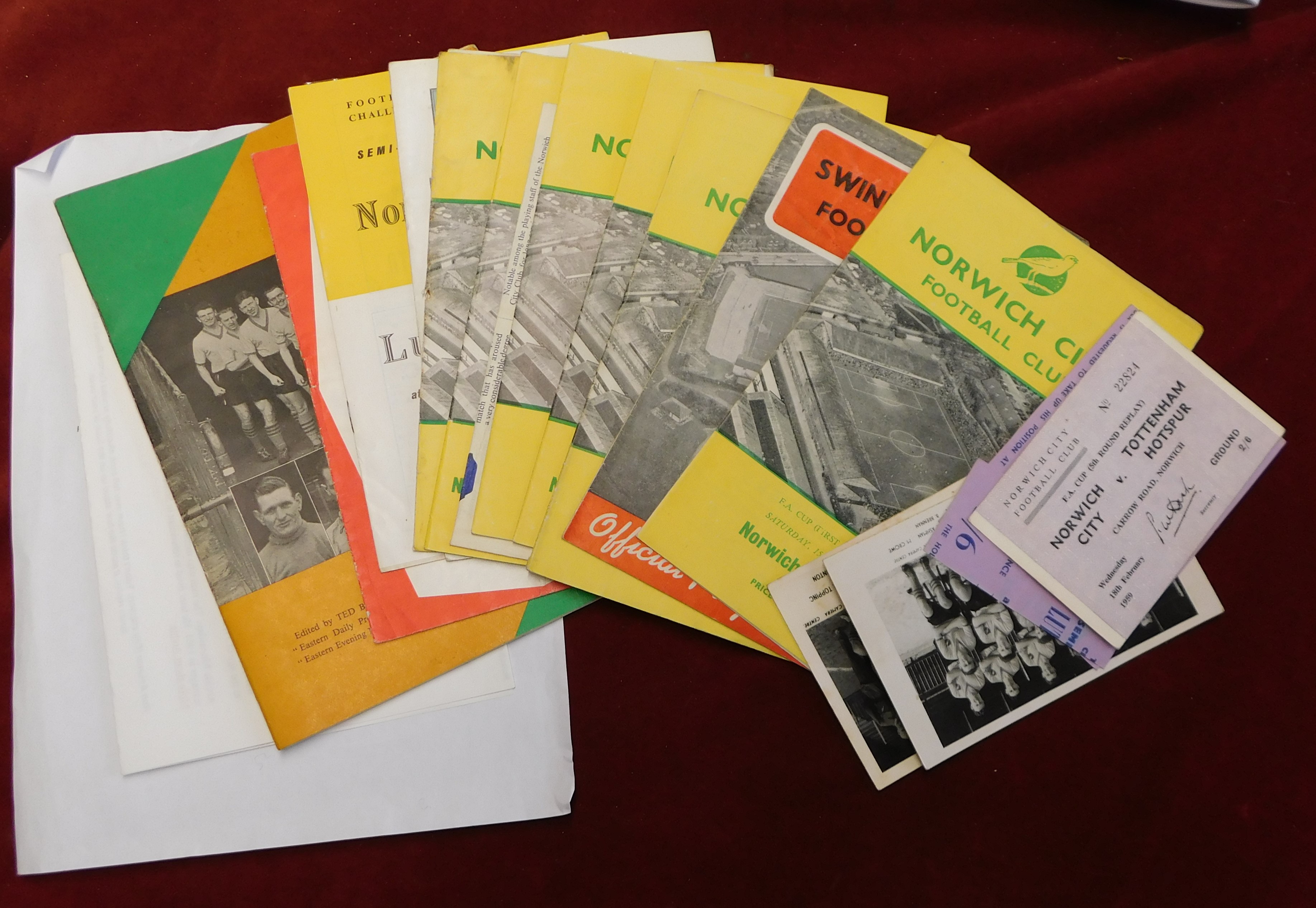 A complete set of 11 programmes (plus 2 tickets and 2 multiple signed postcards) for each of Norwich