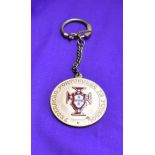 An engraved medal with chain issued by the Portuguese FA for the 1966 World Cup in England. Good