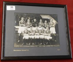 A framed photo (30 cms x 26 cms) of the Manchester United FA Cup winning team of 1948 fully signed